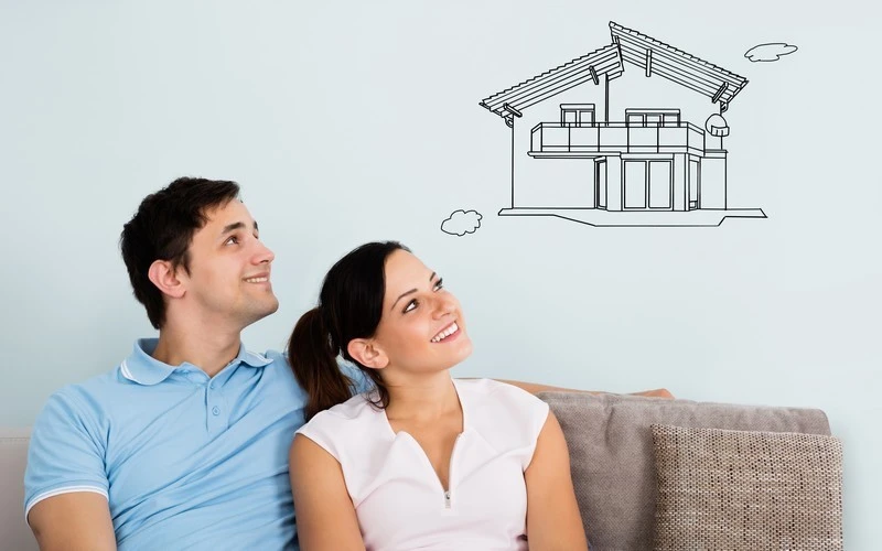 Woman expressing joy after obtaining her mortgage loan with a professional broker